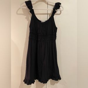 Impeccable Pig large black summer dress with ruffled hem and pleated bodice.